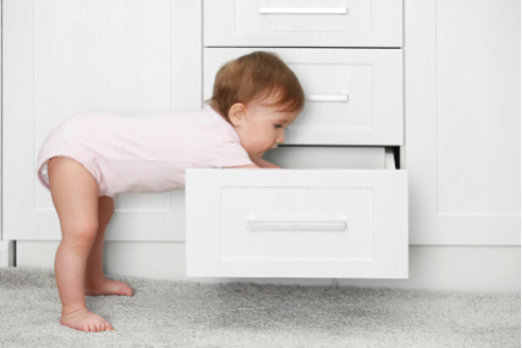 Baby digging in drawer